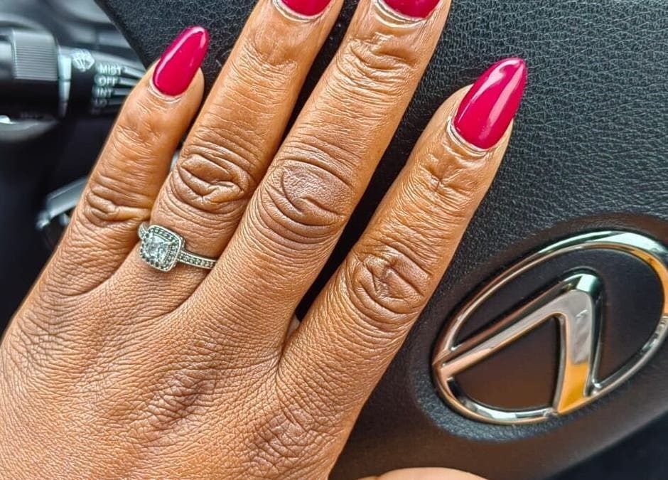 Vibrant red manicure with a diamond ring at House of Nails, Cape Town, Western Cape, ZA.