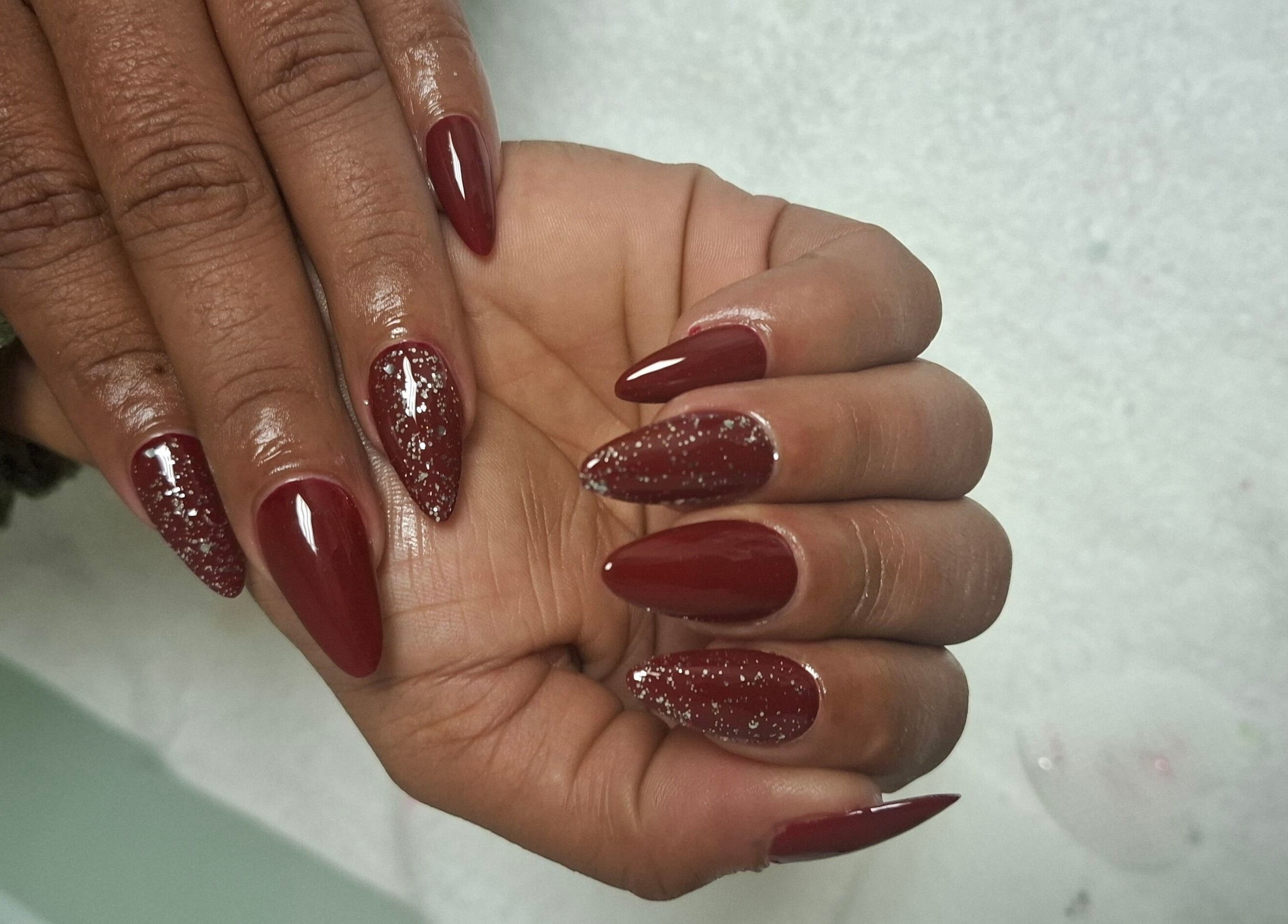 Elegant red nails with glitter accents at House of Nails, Cape Town, Western Cape, ZA.