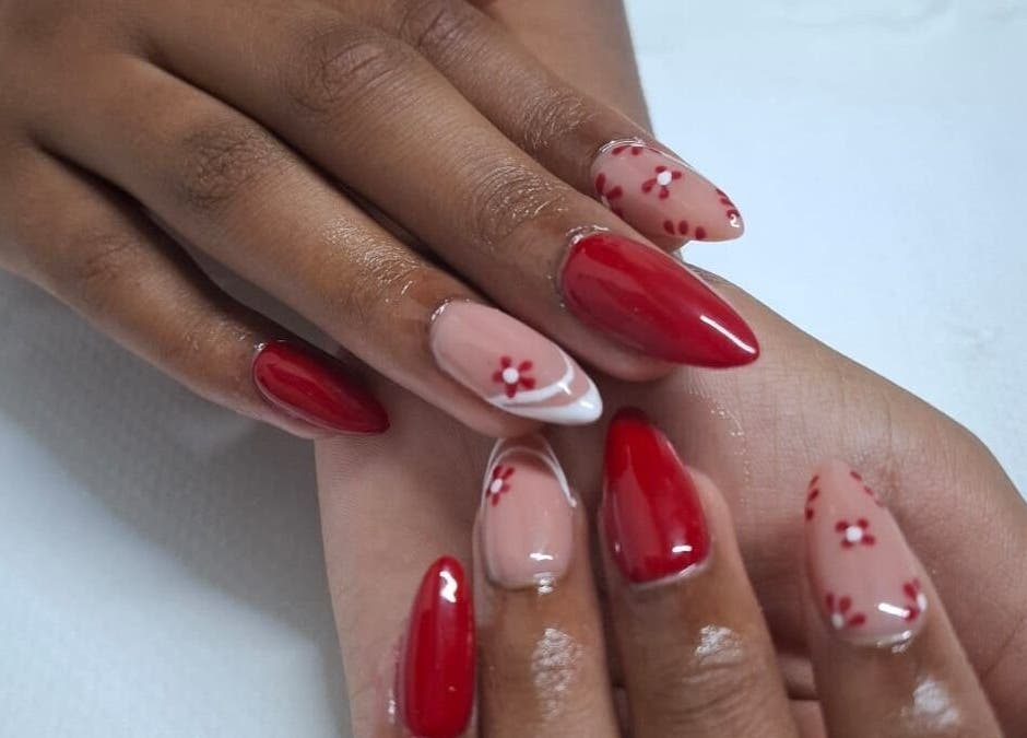 Elegant nail art with red and floral designs at House of Nails, Cape Town, Western Cape, ZA.