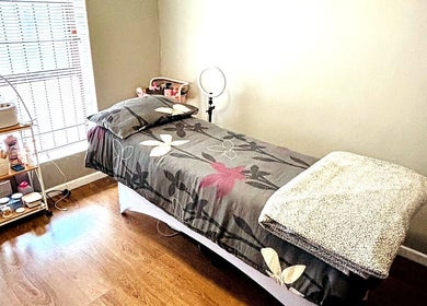 Cozy treatment room at Make Me Pretti‎ in Cape Town, Western Cape, ZA with a well-prepared massage table.