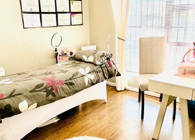 Peaceful treatment room at Make Me Pretti‎, Cape Town, Western Cape, ZA, with floral bedspread and natural light.