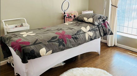 Tranquil spa treatment room at Make Me Pretti‎, Cape Town, Western Cape, ZA with floral bedding.