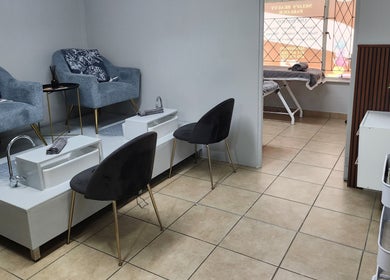 Elegant interior of Nelos Beauty Parlour in Mbombela, Mpumalanga, ZA featuring deluxe pedicure stations.
