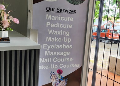 Nelos Beauty Parlour service menu in Mbombela, Mpumalanga, ZA highlighting manicure, pedicure, and more.