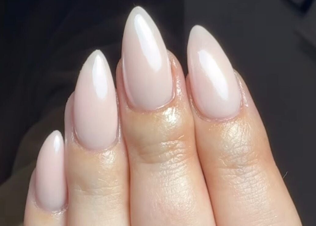 Stunning almond-shaped nude nails by Nails By Lara, Nottingham, England, GB.