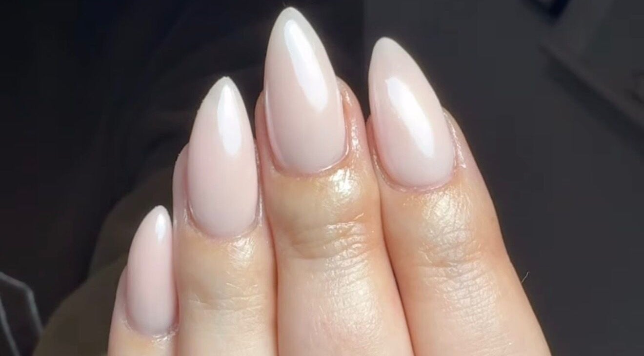 Stunning almond-shaped nude nails by Nails By Lara, Nottingham, England, GB.