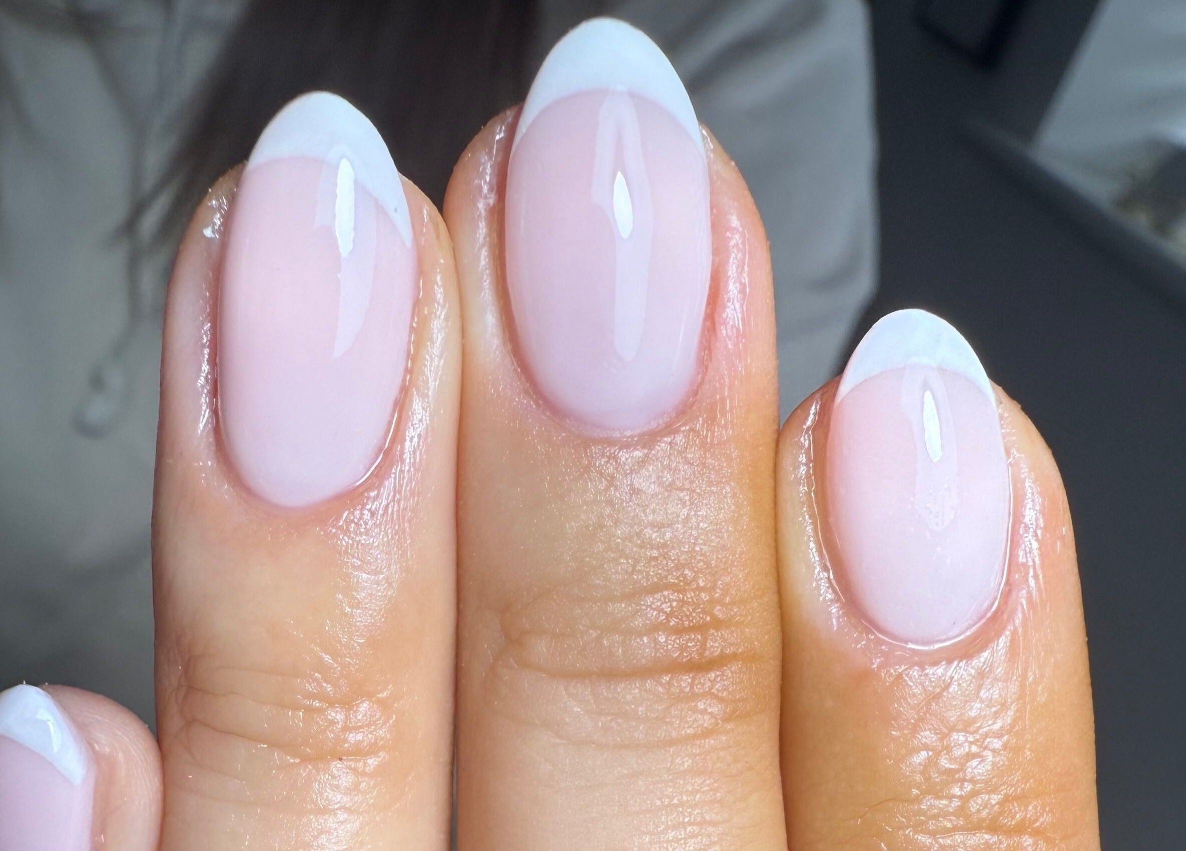 Beautiful French manicure at Nails By Lara, Nottingham, England, GB with glossy finish and white tips.