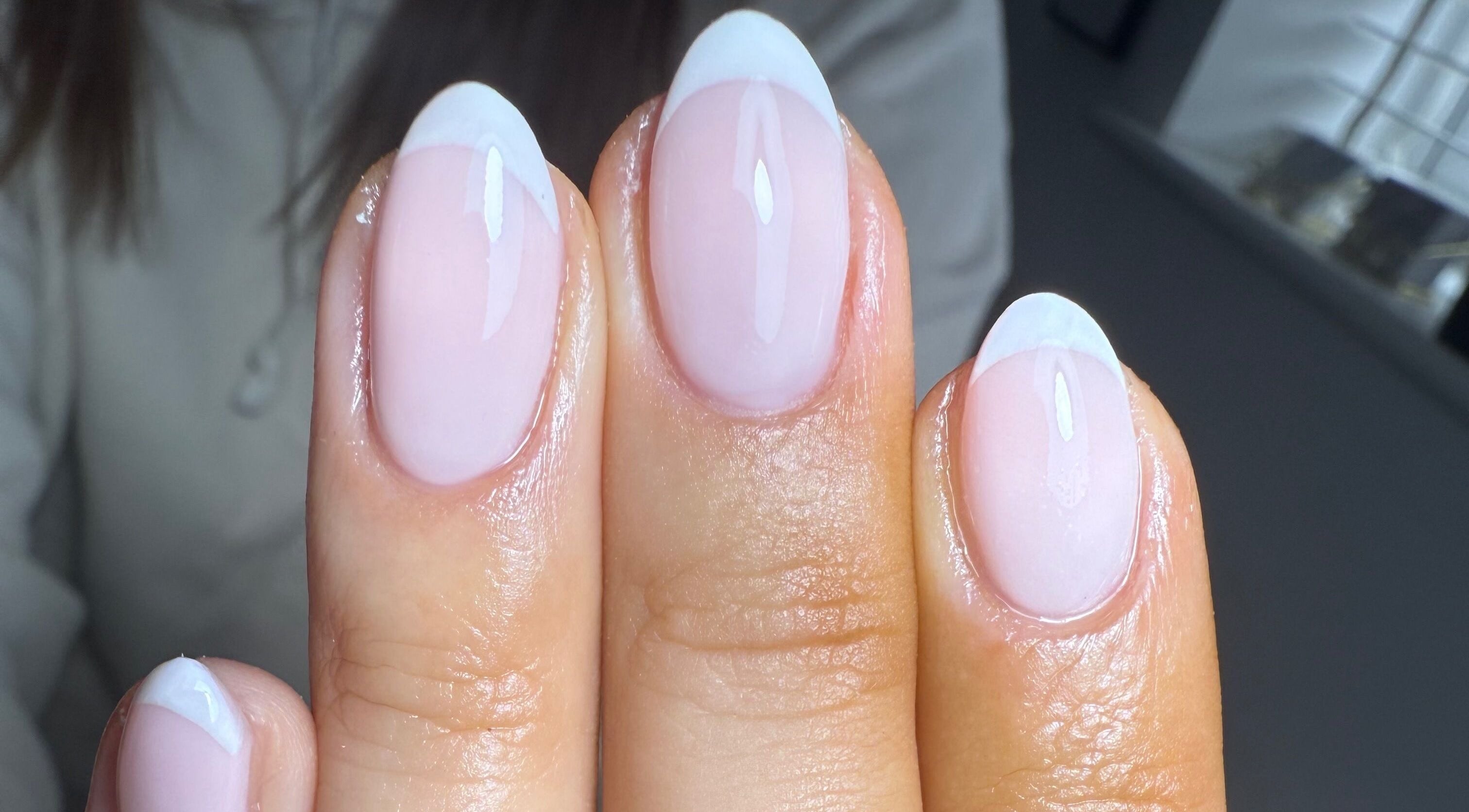 Beautiful French manicure at Nails By Lara, Nottingham, England, GB with glossy finish and white tips.