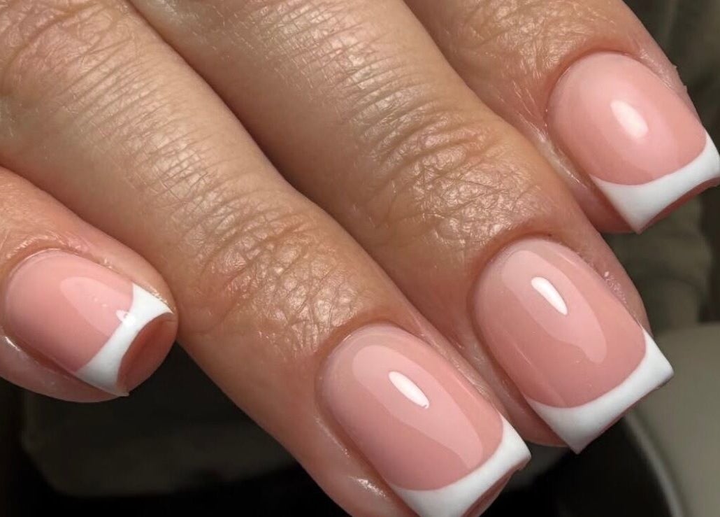 Elegant French manicure at Nails By Lara, Nottingham, England, GB showcasing classic nail art.
