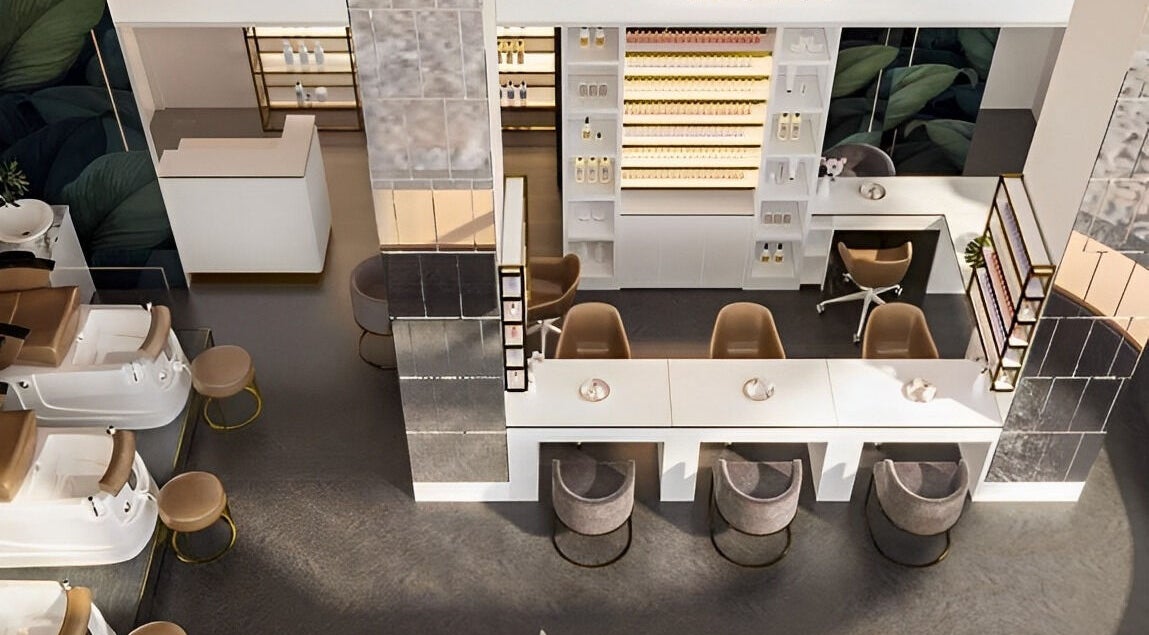 Inside Icon Nails & Beauty, Zürich: elegant salon with plush chairs and modern decor for a luxurious experience.