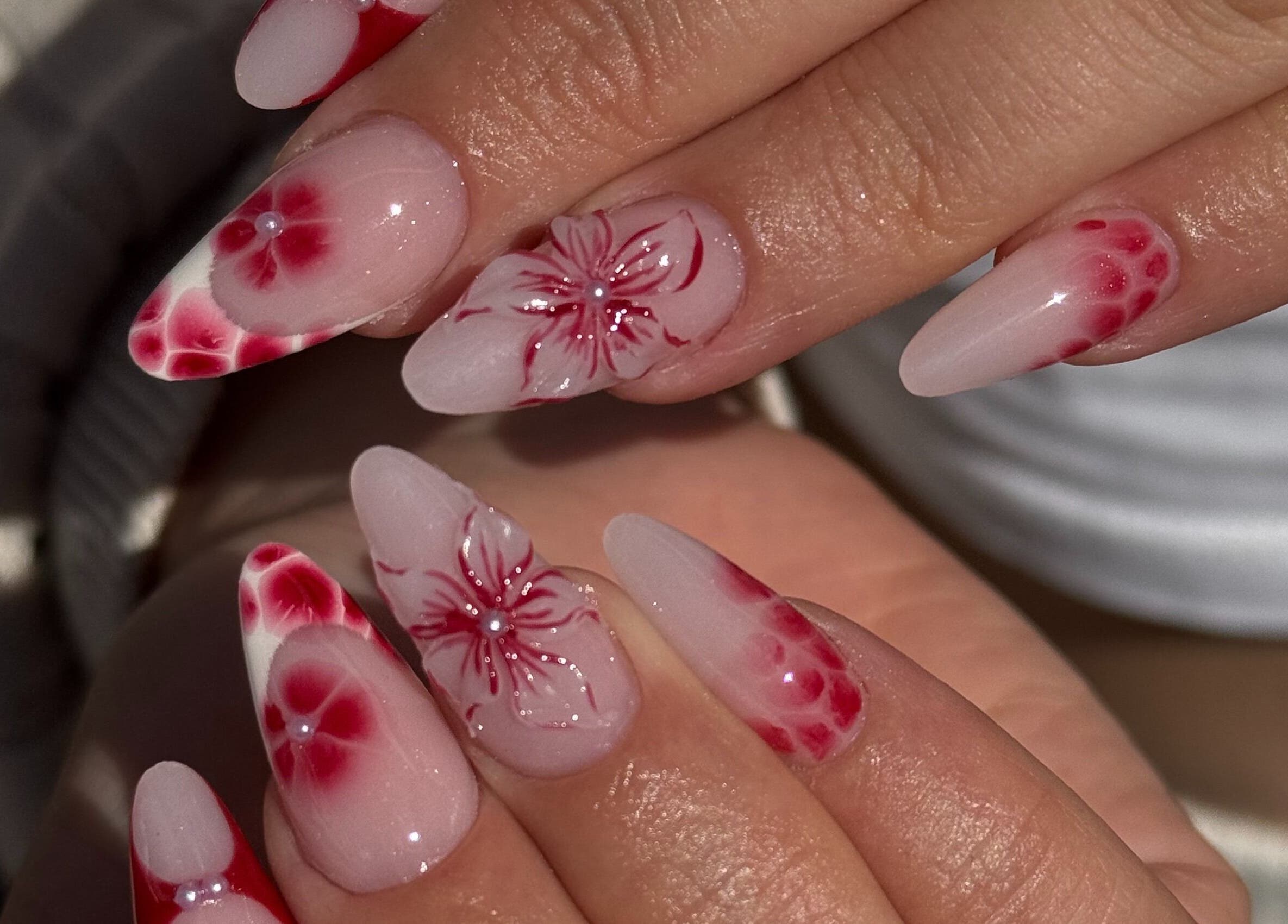 Red floral nail art at Icon Nails & Beauty, Zürich, Zürich, CH showcasing intricate designs.