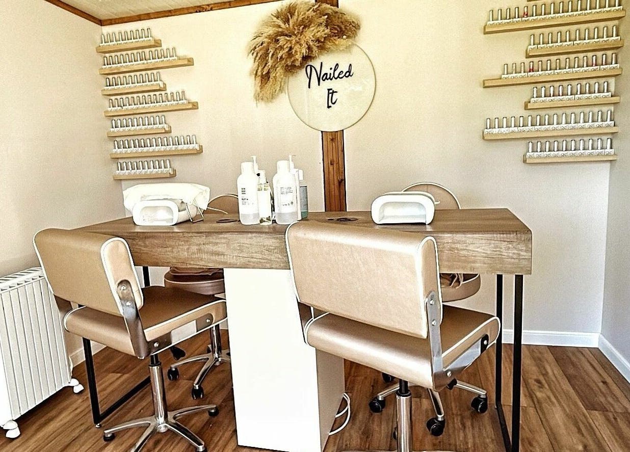 Elegant nail salon setup at The Cabin in Cossall, England, GB, featuring stylish chairs and nail products.