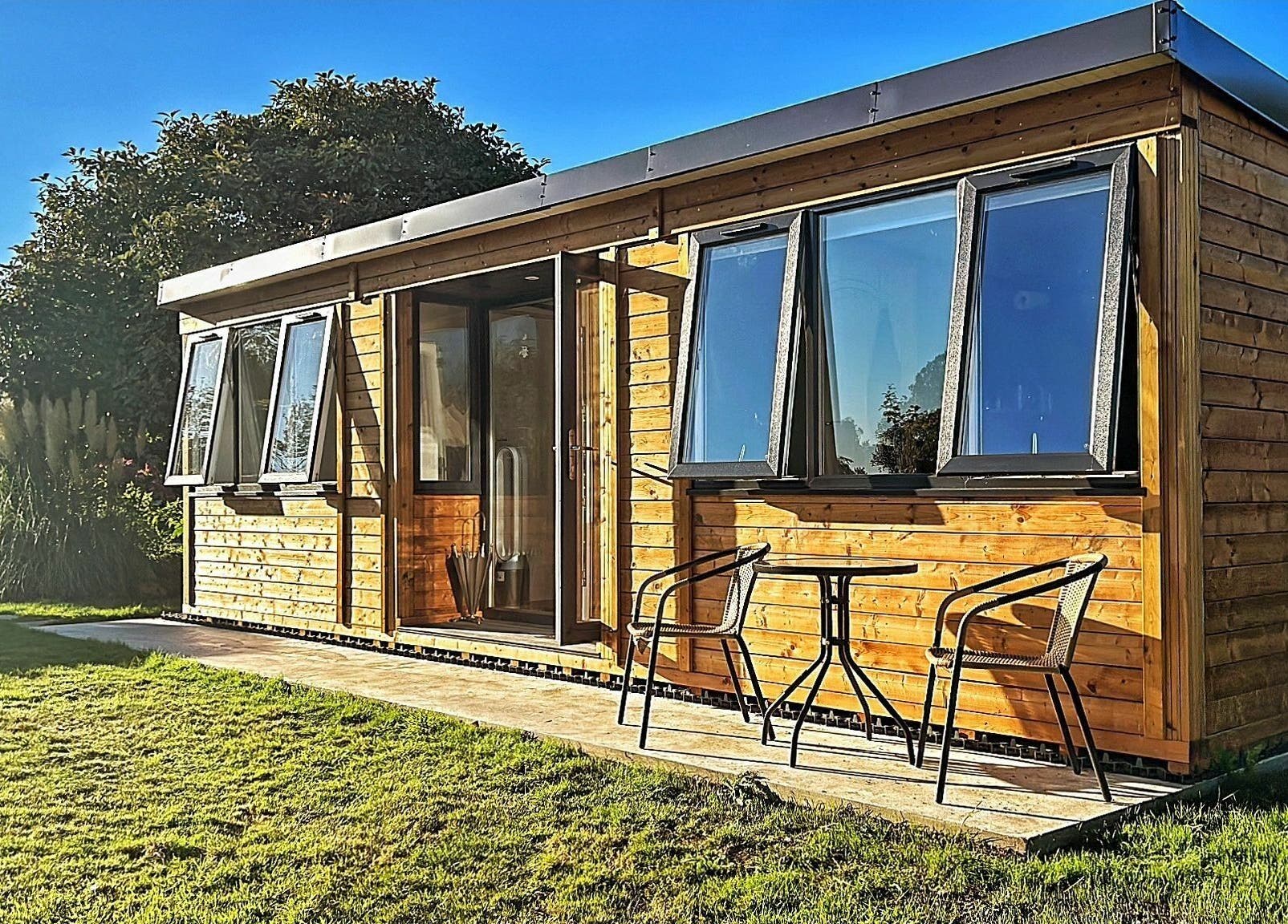 Charming wooden cabin exterior at The Cabin, Cossall, England, GB, perfect for a relaxing retreat.