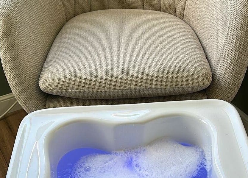 Comfortable spa chair with foot bath at The Cabin, Cossall, England, GB, enhancing relaxation experience.