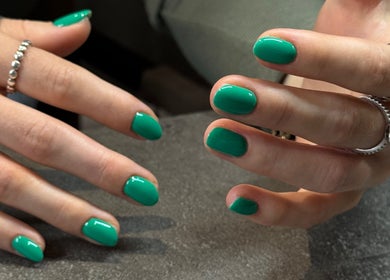Emerald green nails at Irysha.beauty, Chichester, England, GB. Stunning manicure showcasing vibrant color.
