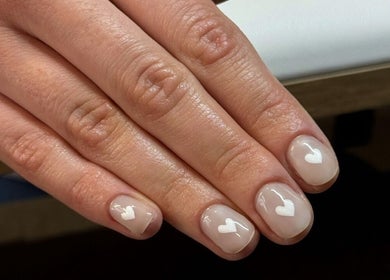 Manicured nails with heart designs at Irysha.beauty, Chichester, England, GB.
