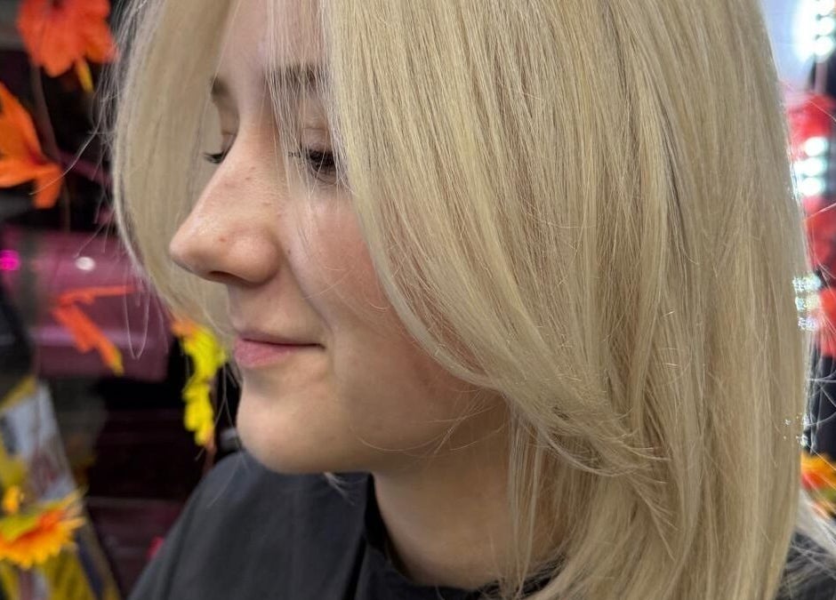 Blonde hairstyle at BrighTouch salon, New York, New York, US, showcasing vivid autumnal décor.