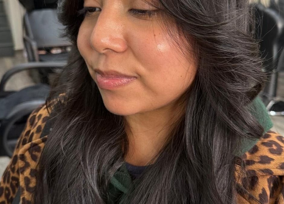 Woman with styled long hair at BrighTouch salon, New York, New York, US.