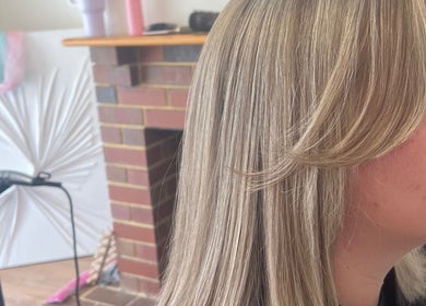 Woman with shiny, styled blonde hair at Haus of Hair & Beauty, The Vines, Western Australia, AU.