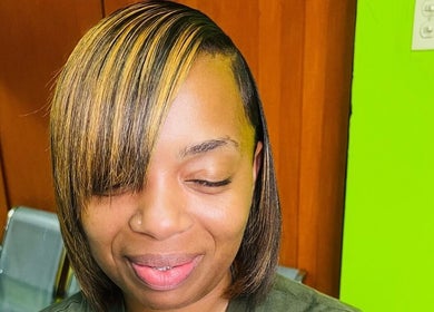 Woman with a sleek hairstyle at Edge Allure Beauty, Kingston, St. Andrew Parish, JM.