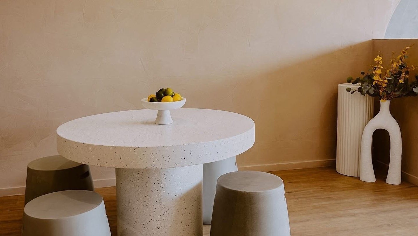 Elegant seating area with round table at Beyond Beauty & Brows Au, Hope Island, Queensland, AU.