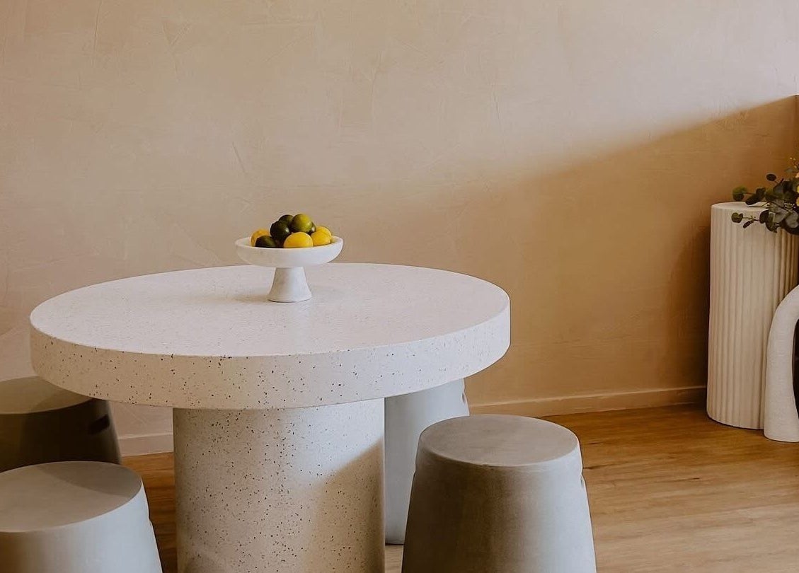 Elegant seating area with round table at Beyond Beauty & Brows Au, Hope Island, Queensland, AU.