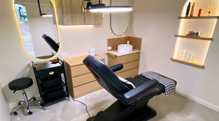 Modern treatment room at e-skin, Mermaid Waters, Queensland, AU, featuring sleek furnishings and ambient lighting.