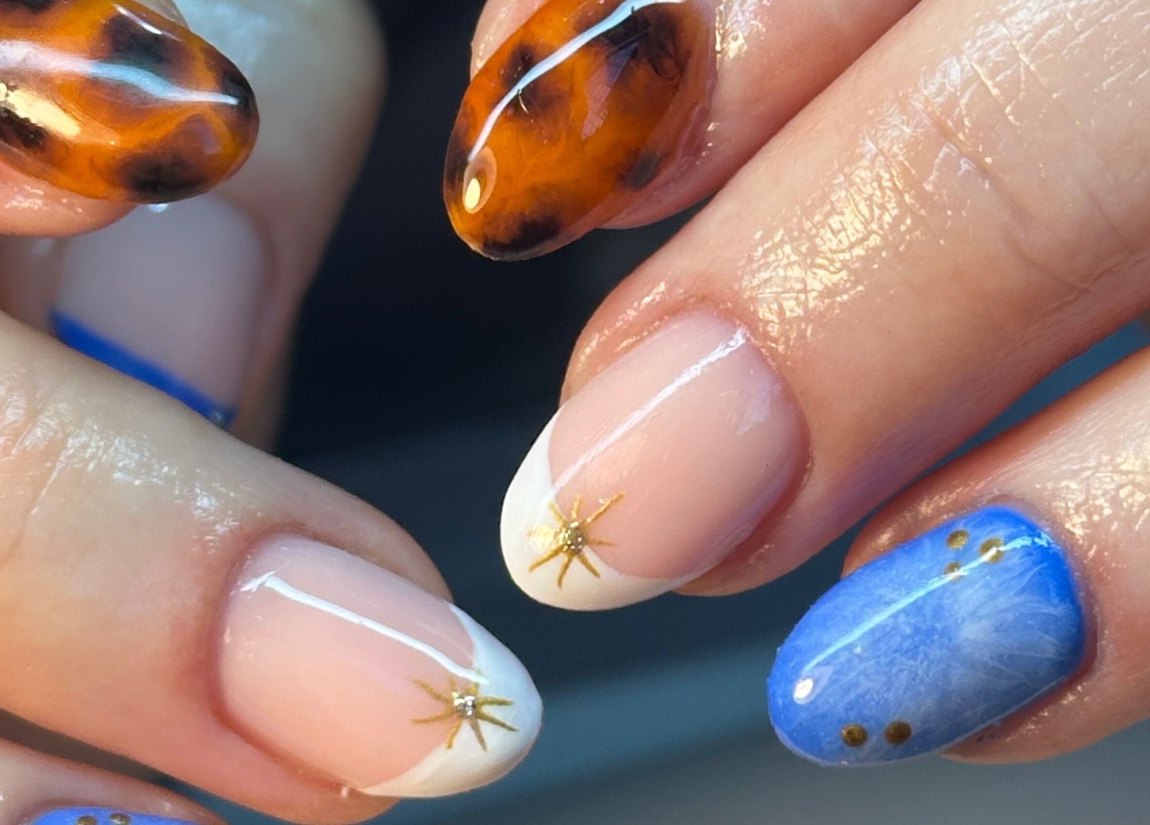 Artistic nail designs at BEAUTIMAX in Stockport, England, GB showcasing unique patterns and vibrant colors.