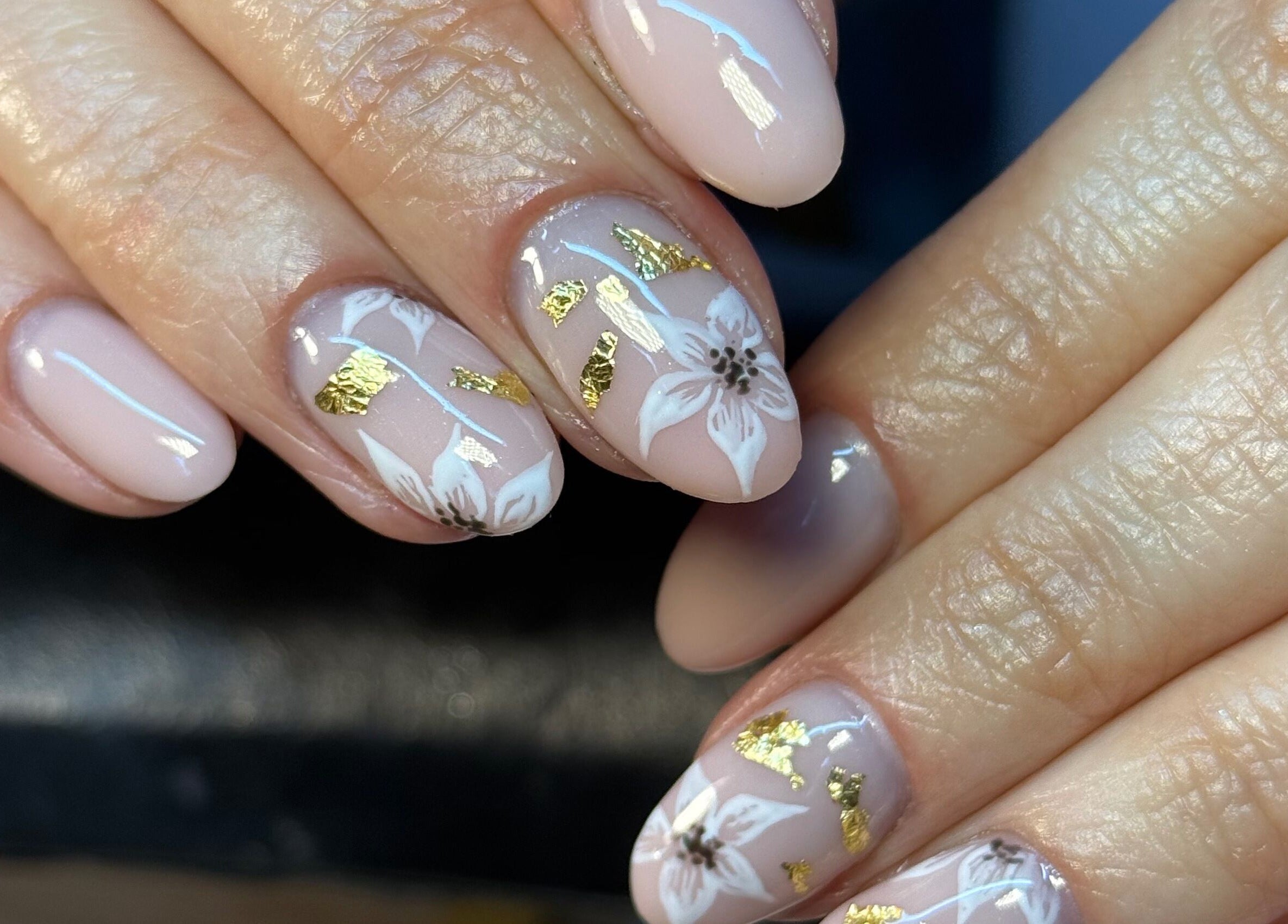 Elegant floral nail art with gold accents at BEAUTIMAX, Stockport, England, GB offering unique beauty designs.