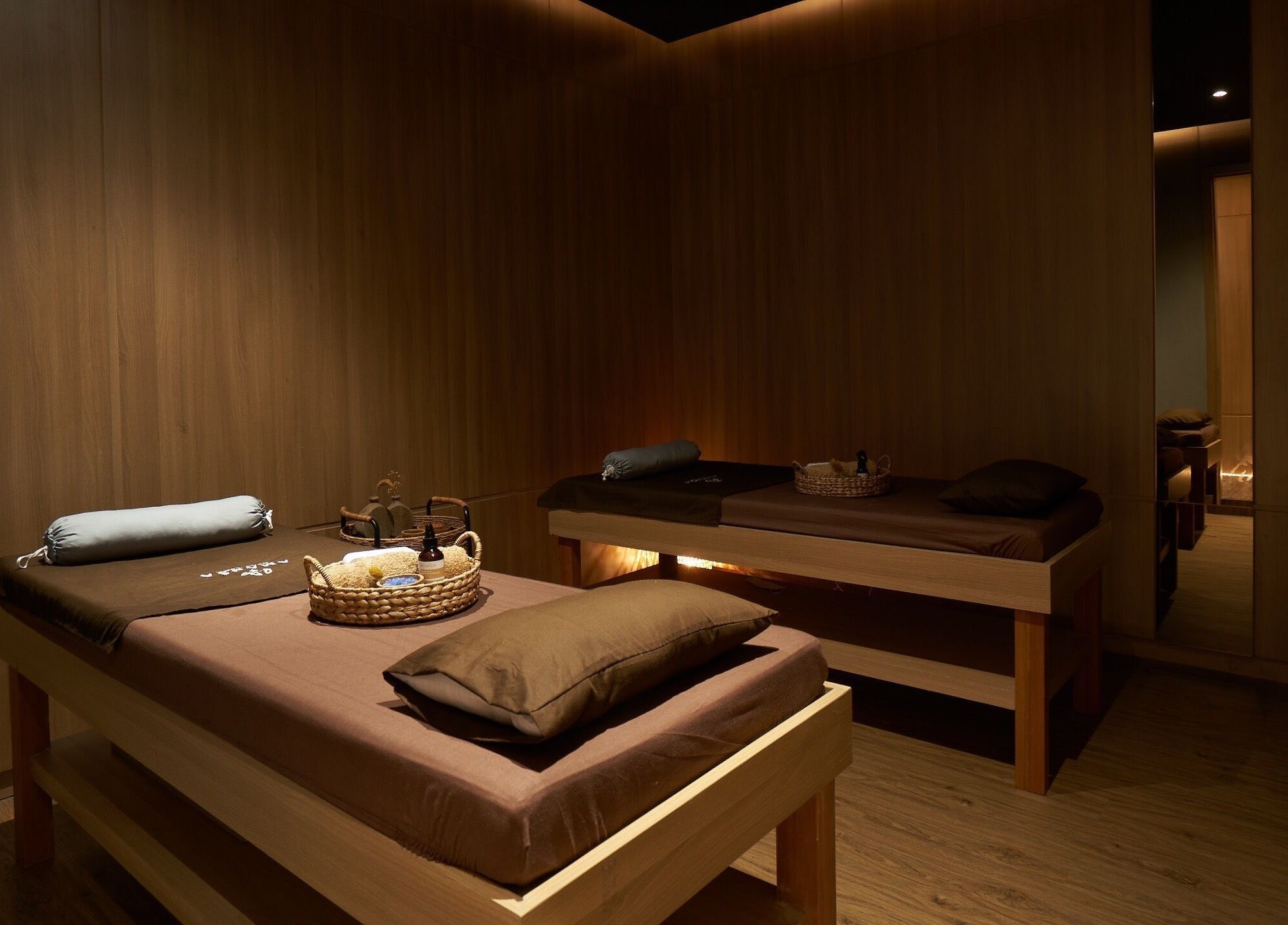 Relaxing treatment room at Amansa Spa and Wellness Solo, Central Java, Central Java, ID with massage tables.