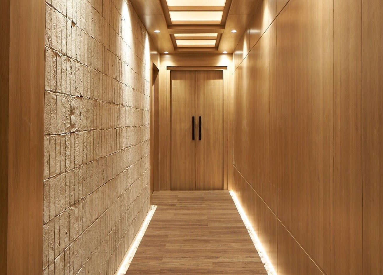 Peaceful corridor at Amansa Spa and Wellness Solo, Central Java, Central Java, ID, featuring wooden accents and soft lighting.