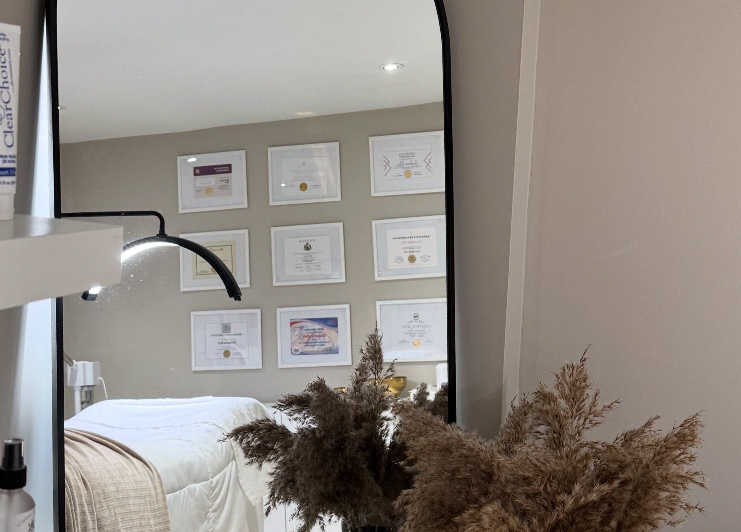 Tranquil treatment room with mirror at Casa Blanca Beauty, Vaughan, Ontario, CA, showcasing soothing decor.