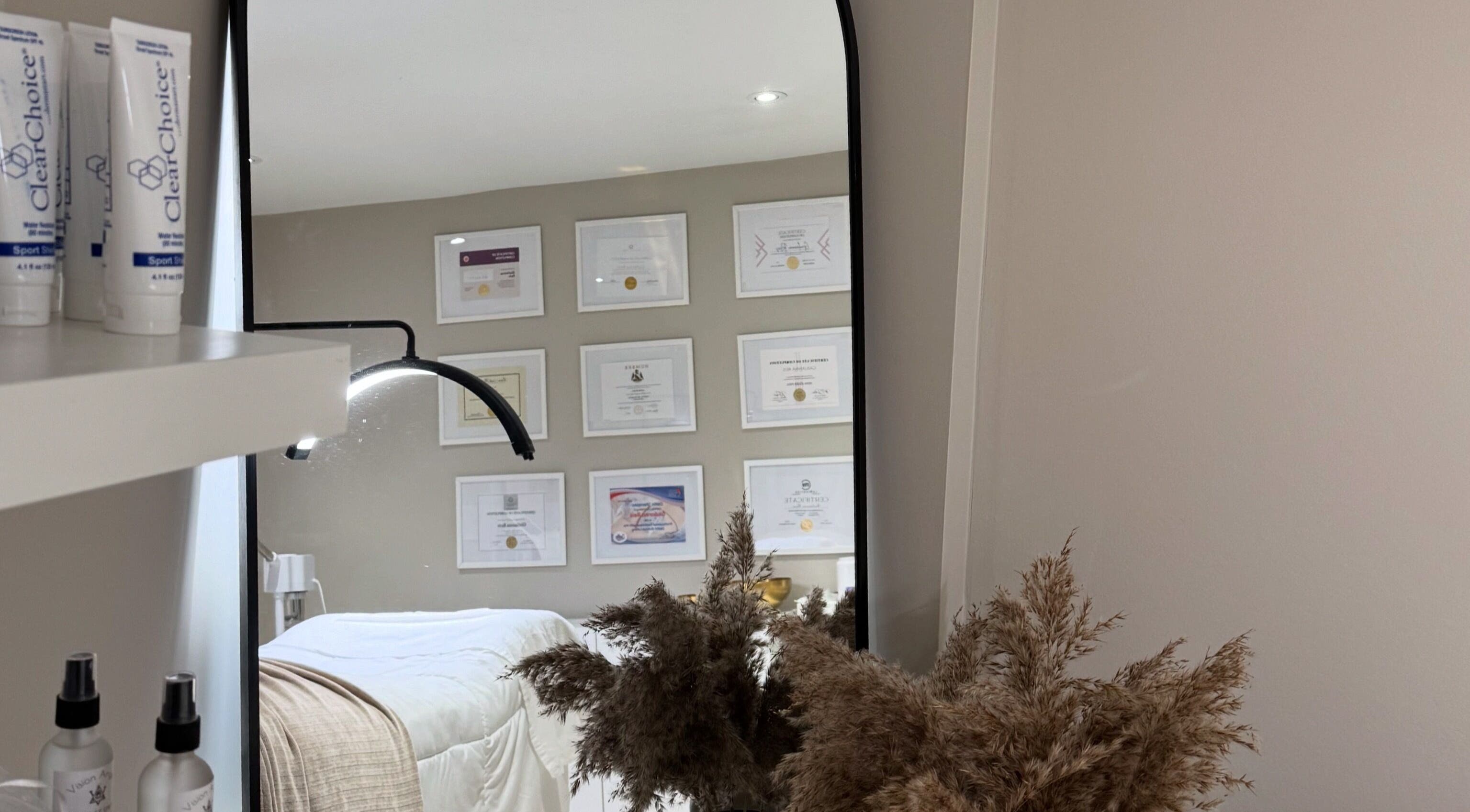 Tranquil treatment room with mirror at Casa Blanca Beauty, Vaughan, Ontario, CA, showcasing soothing decor.