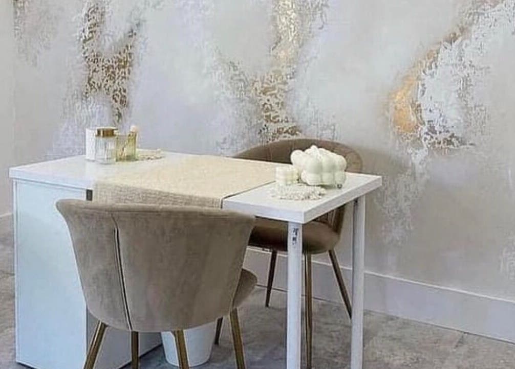 Sophisticated salon corner at Heavenly Beauty, Ramsbottom, England, GB, featuring a chic table and chairs.