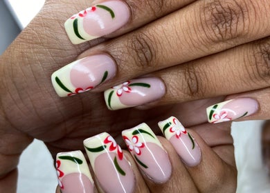 Elegant floral nail art at Pretty Nails By Sasha in Rockledge, Florida, US, showcasing intricate design.