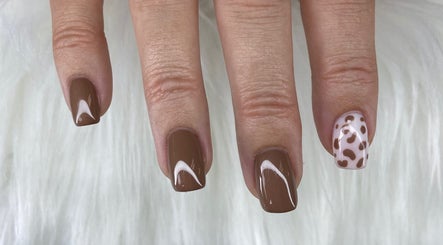 Elegant brown and cream nail art at Pretty Nails By Sasha, Rockledge, Florida, US.