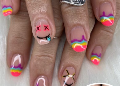Colorful rainbow nail art design at Pretty Nails By Sasha in Rockledge, Florida, US.