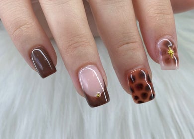 Stylish nail art in rich earth tones at Pretty Nails By Sasha, Rockledge, Florida, US.