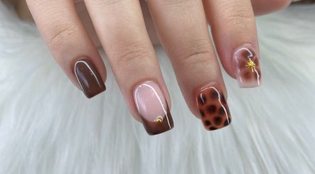 Stylish nail art in rich earth tones at Pretty Nails By Sasha, Rockledge, Florida, US.