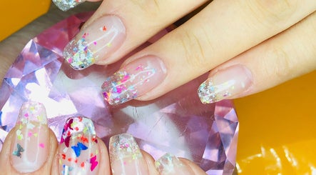 Colorful glitter nails at Organic Nail Care by Enji, Pelican Waters, Queensland, AU.