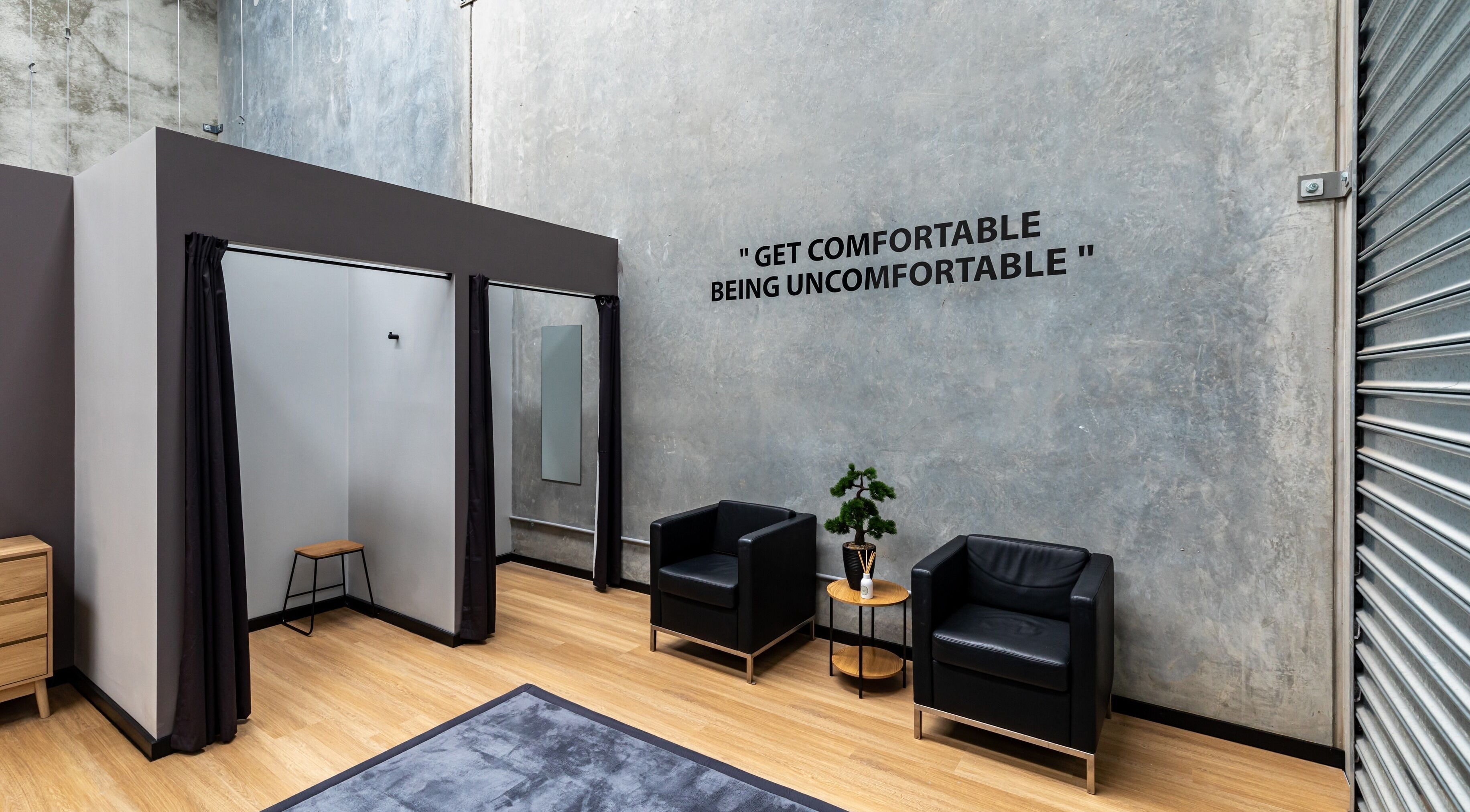 Modern relaxation area at XM Recovery, Rouse Hill, NSW, AU with stylish decor and motivational quote.