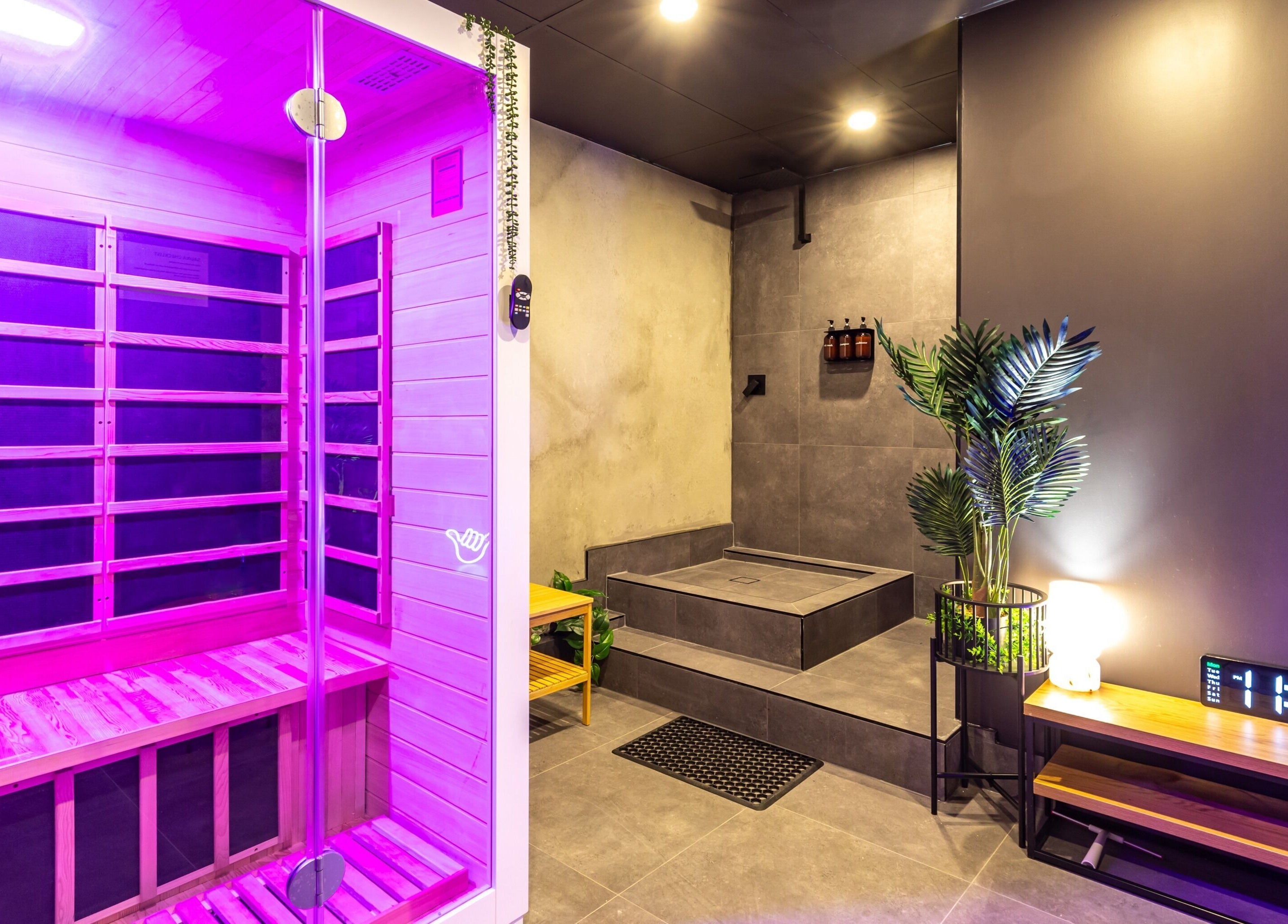 Relaxing sauna space at XM Recovery, Rouse Hill, New South Wales, AU with vibrant lighting and modern decor.
