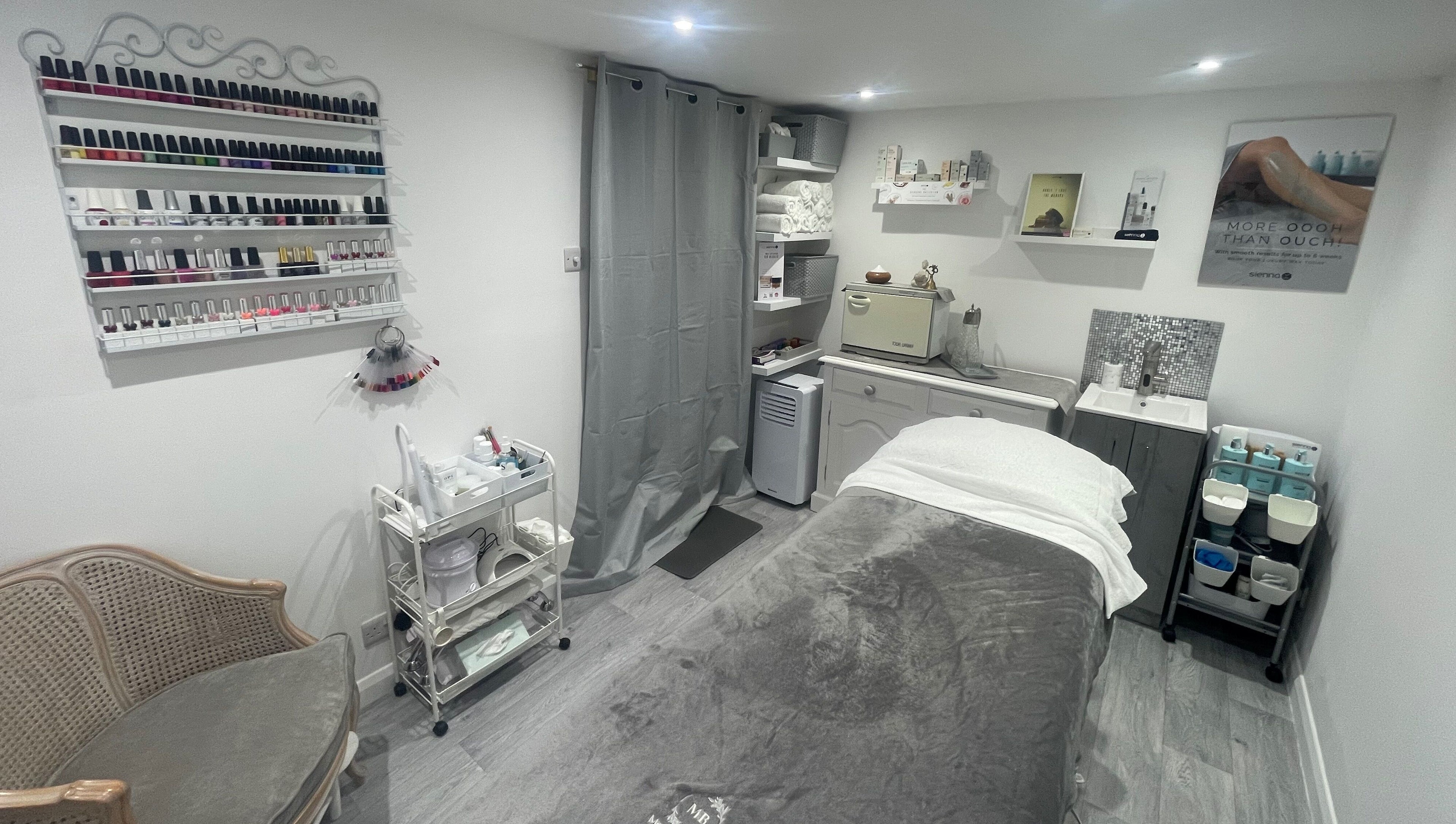 Relaxing treatment room at Moore Beauty in Knaphill, England, GB, showcasing nail polishes and relaxing decor.