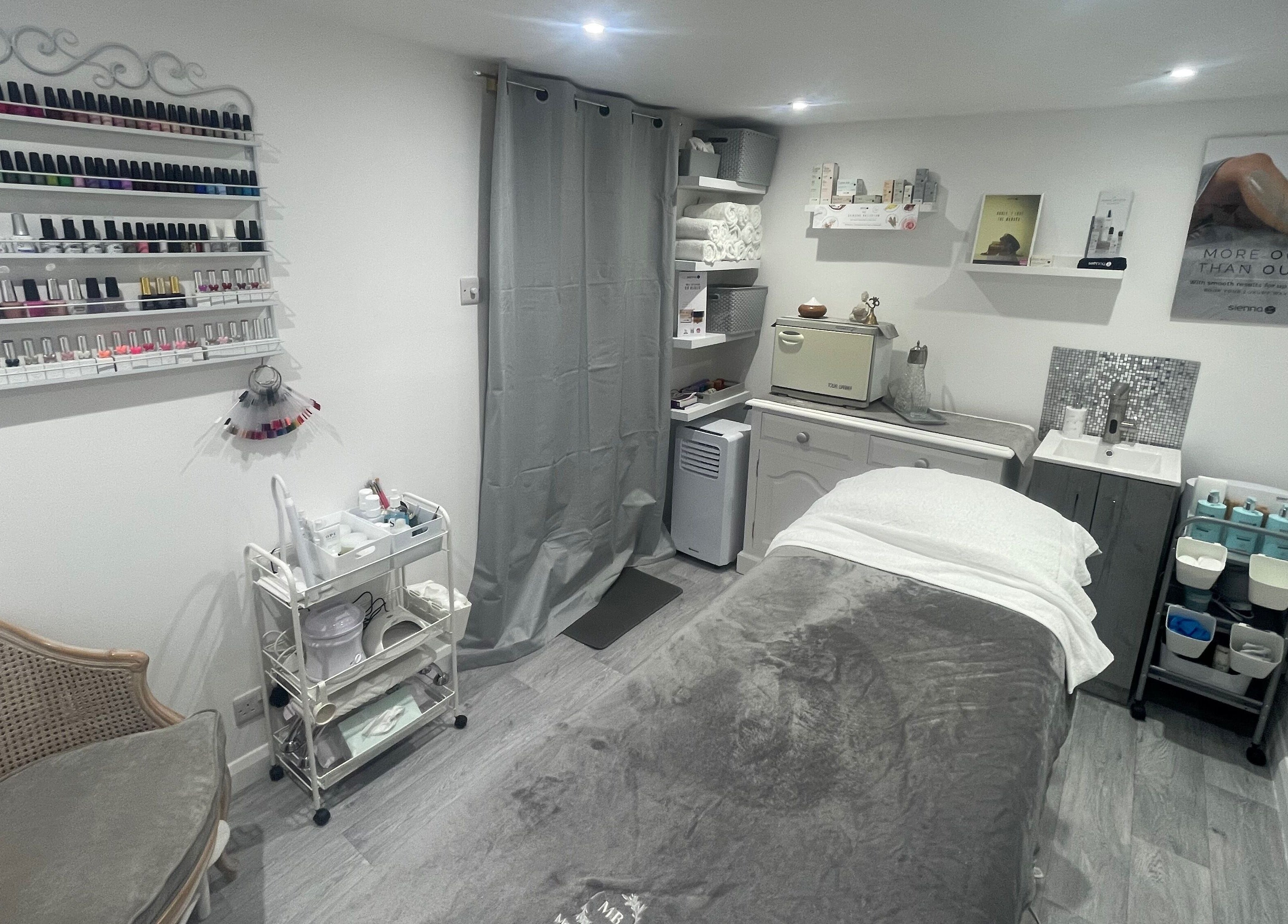 Relaxing treatment room at Moore Beauty in Knaphill, England, GB, showcasing nail polishes and relaxing decor.