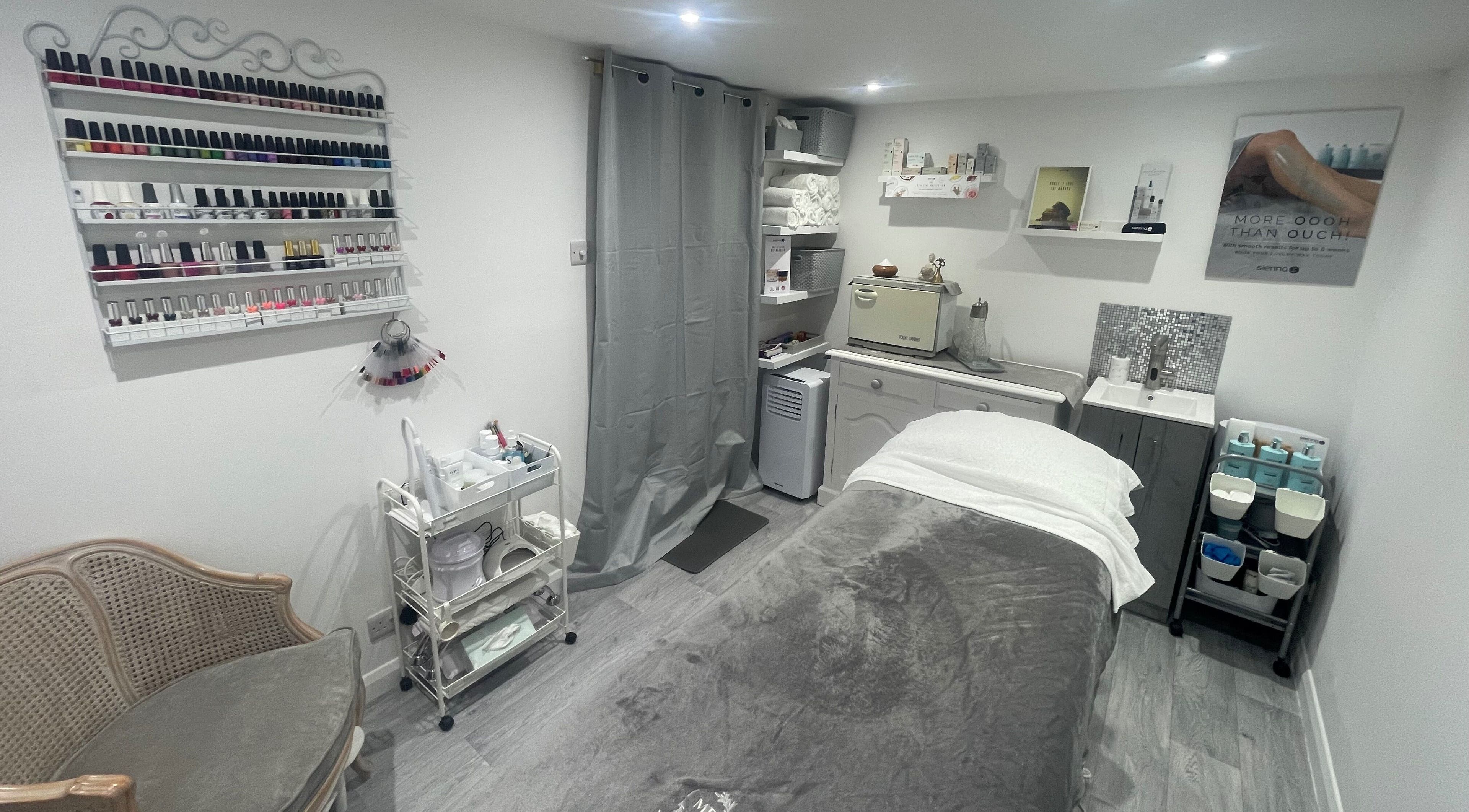 Relaxing treatment room at Moore Beauty in Knaphill, England, GB, showcasing nail polishes and relaxing decor.