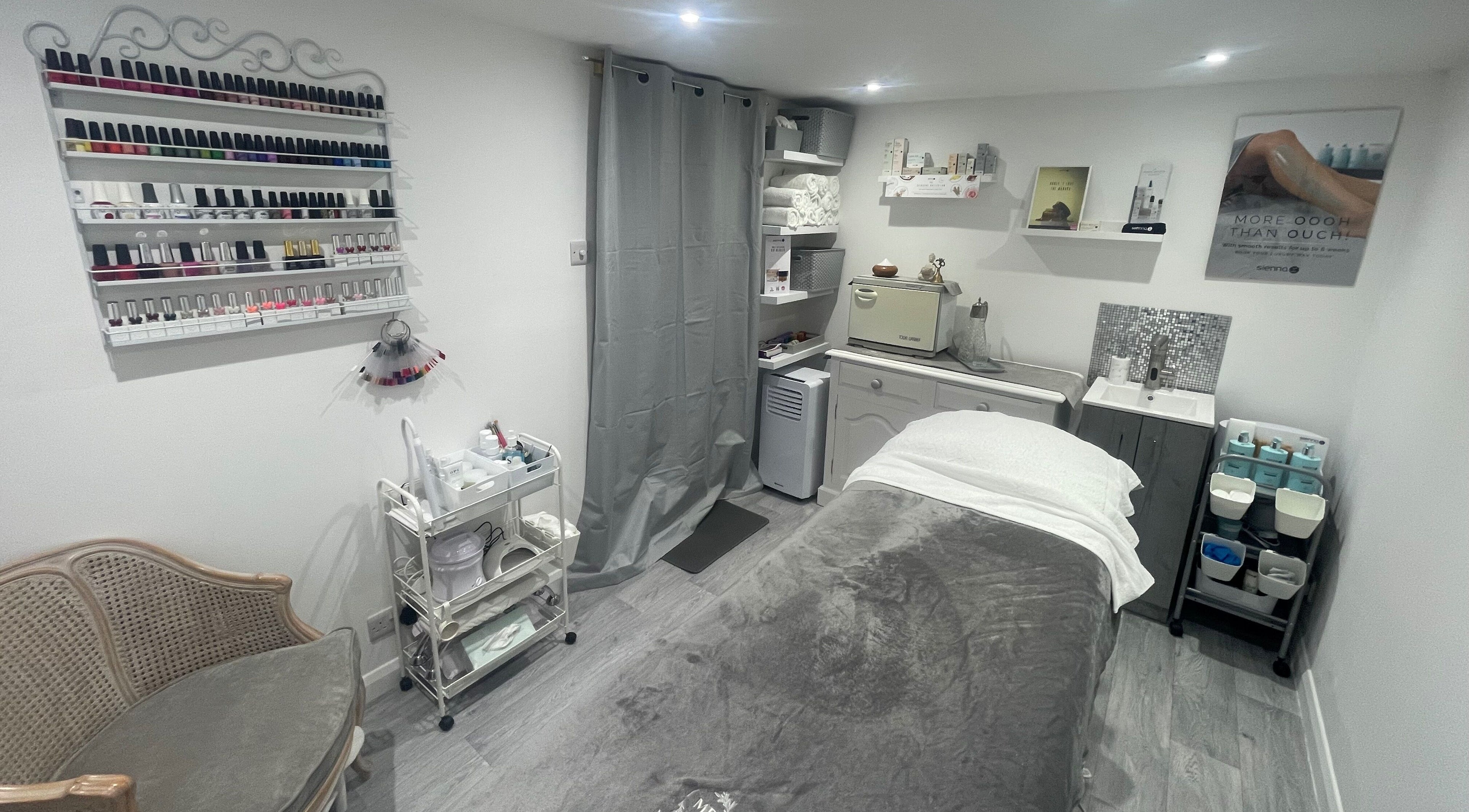 Relaxing treatment room at Moore Beauty in Knaphill, England, GB, showcasing nail polishes and relaxing decor.