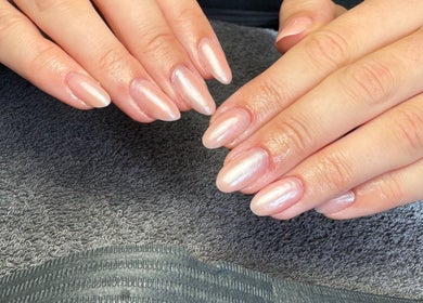 Elegant manicured nails at By Kadie, Throckley, England, GB showcasing a smooth pearl finish.