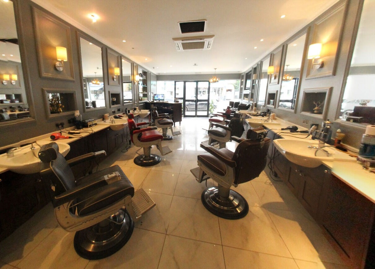 Elegant barber chairs at The Stag - Mill Hill, a stylish salon in London, England, GB.