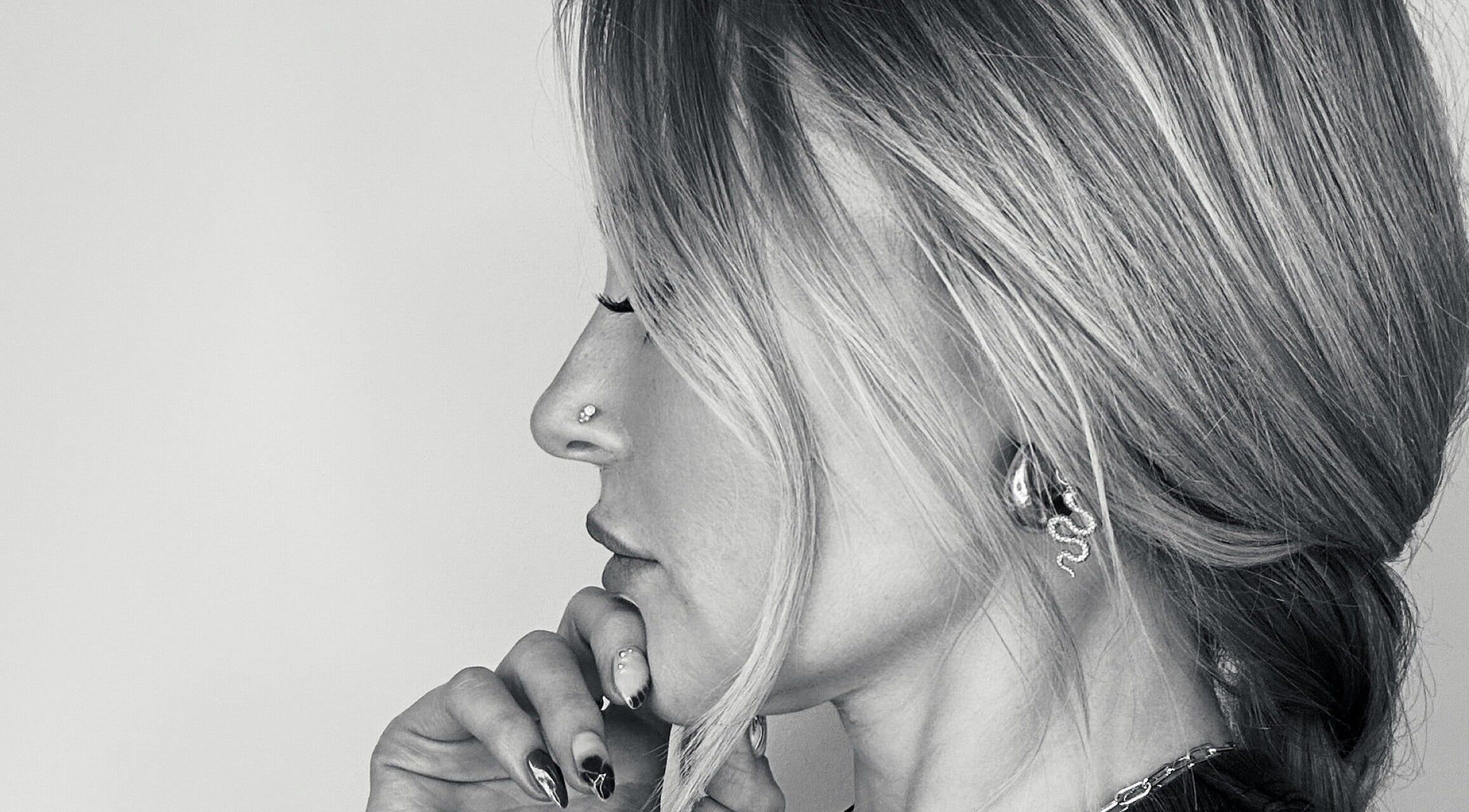 Stylish side view of a woman with elegant hair at Amy Curran Hair and Makeup, Altrincham, England, GB.