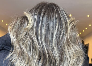 Highlighted waves at Amy Curran Hair and Makeup in Altrincham, England, GB. Perfectly styled for shine.